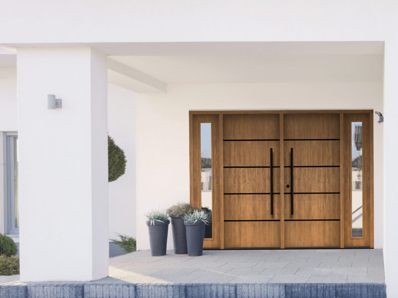 MASTERGRAIN fiberglass door in Cherry, Contemporary Stainless Inlay in Tea with Milk stain by Sherwin Williams.